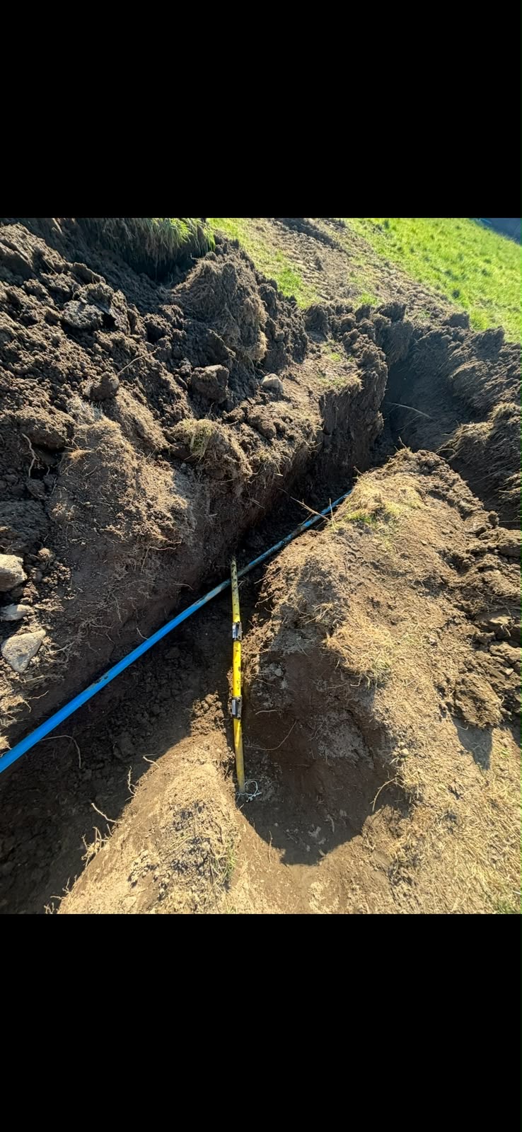 Blue mains water pipe laid in trench